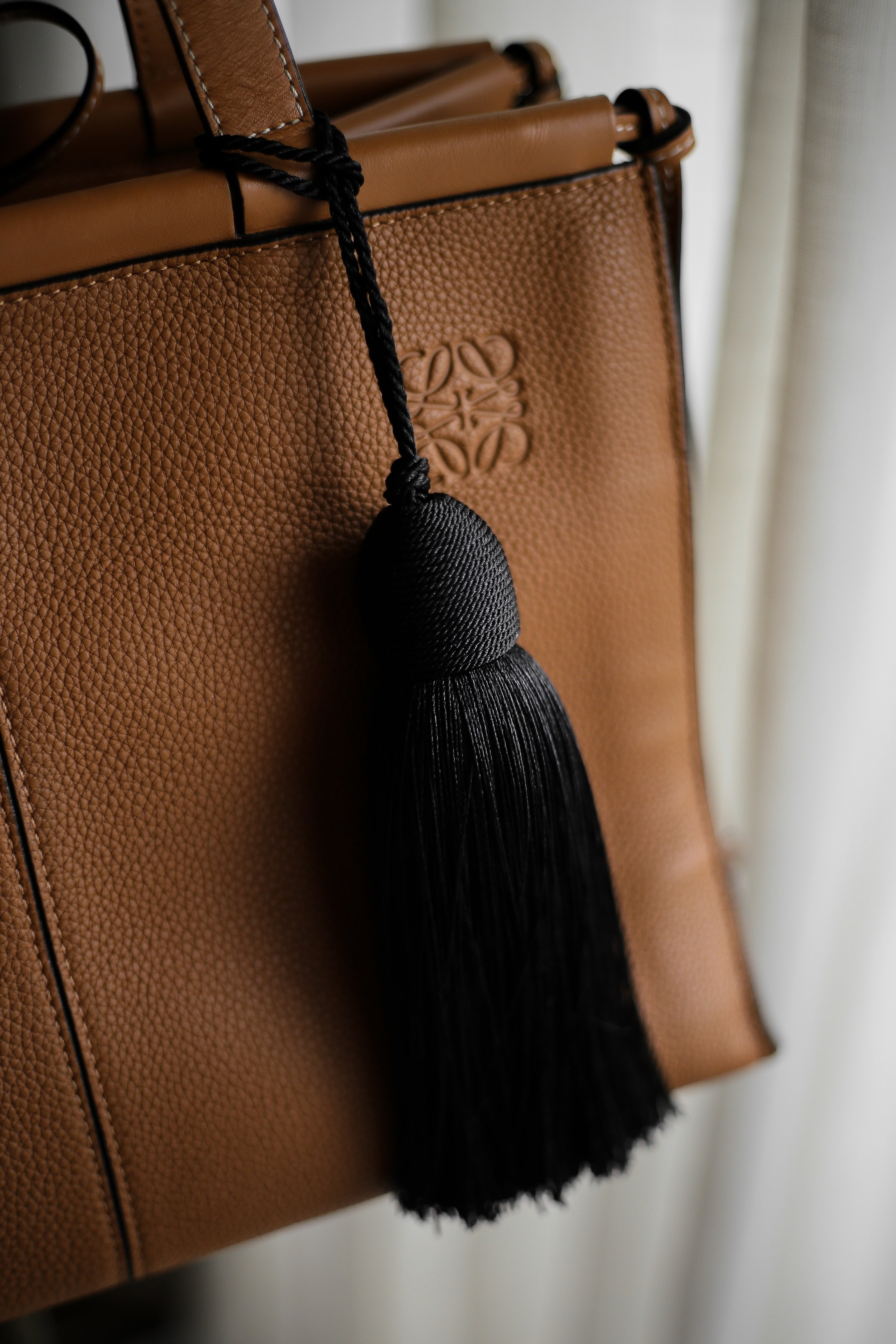 Bon Bon Tassel Bag Charm - Boutique Minimaliste has waterproof, durable, elegant and vintage inspired jewelry